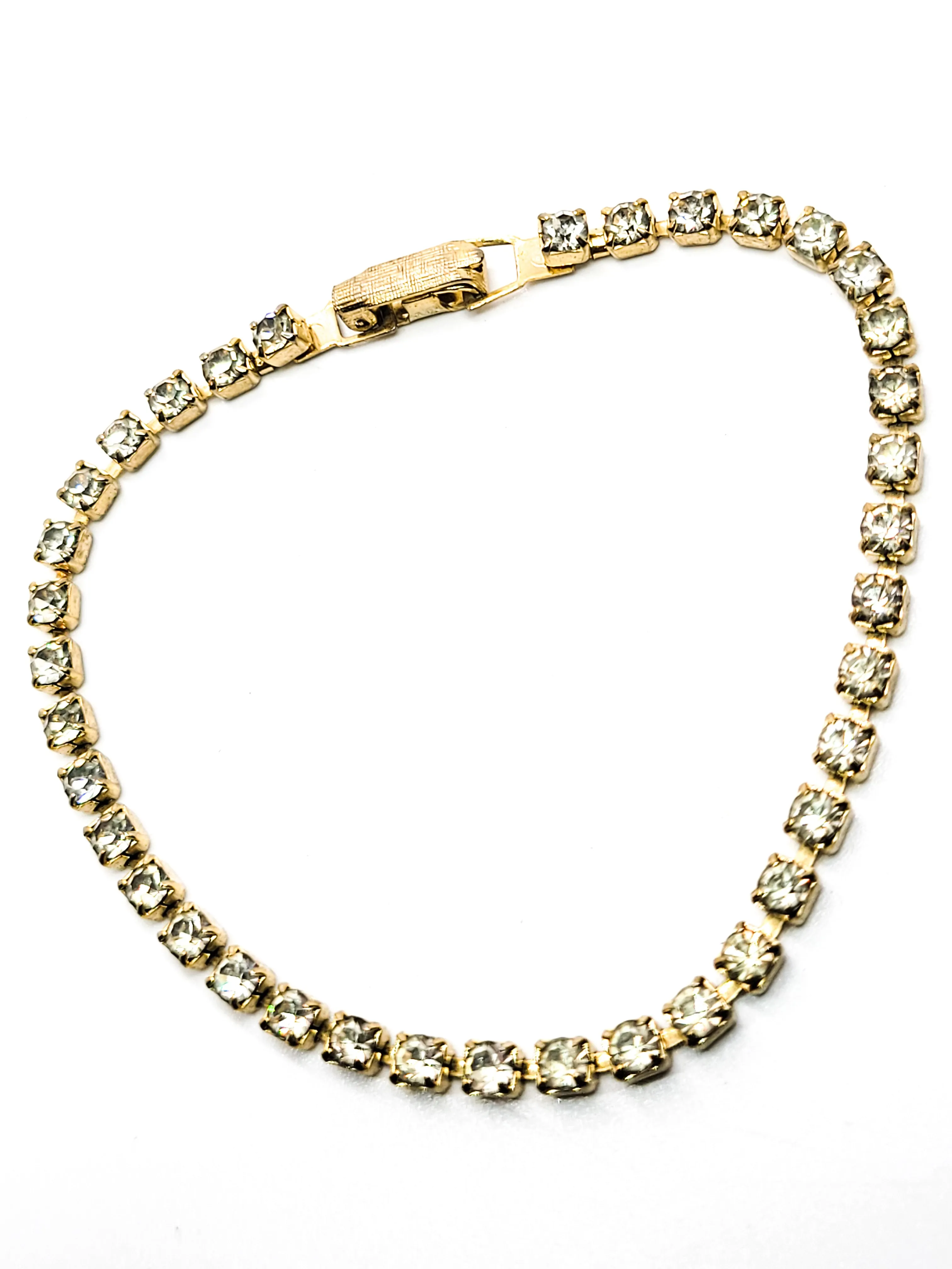 Single row simple clear gold toned vintage rhinestone tennis bracelet