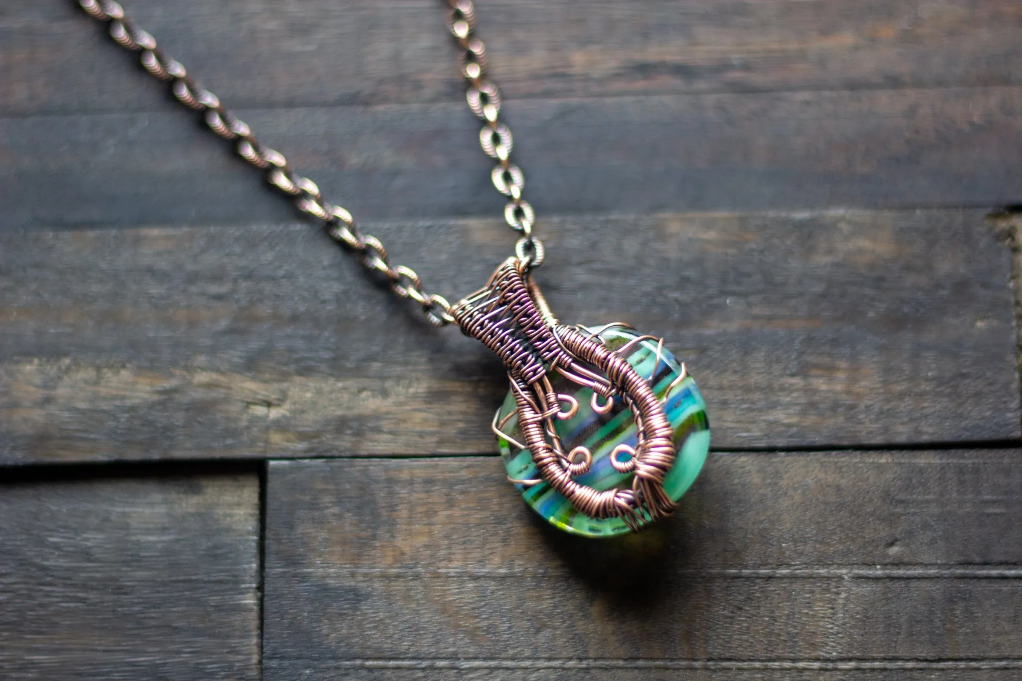 Stripes of Green and Blue Fused Glass and Copper Wire Wrapped Tree of Life Pendant